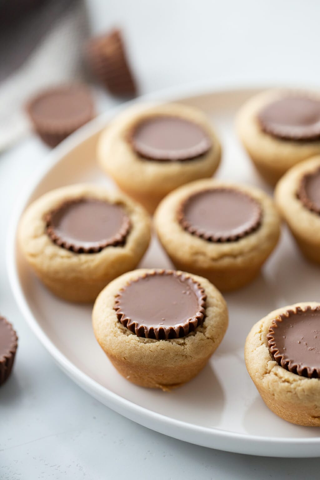 Peanut Butter Cup Cookies with a Reese's Peanut Butter Cup placed in the center of the cookie.