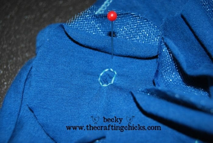 sewing on the circle flower with a round stitch