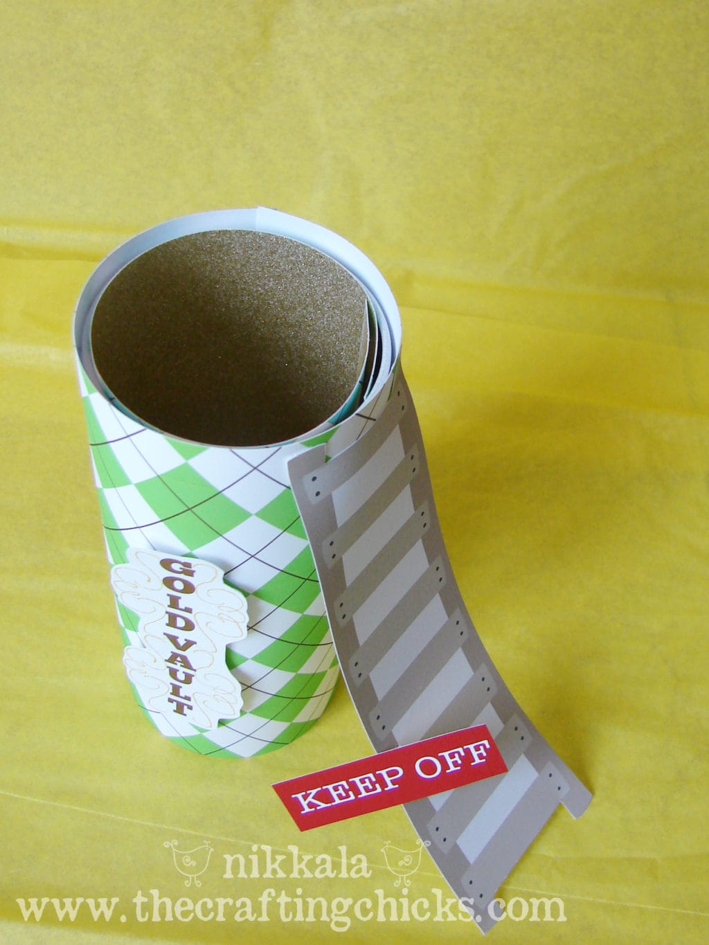 Leprechaun trap made with scrabbook paper and an old chip can.
