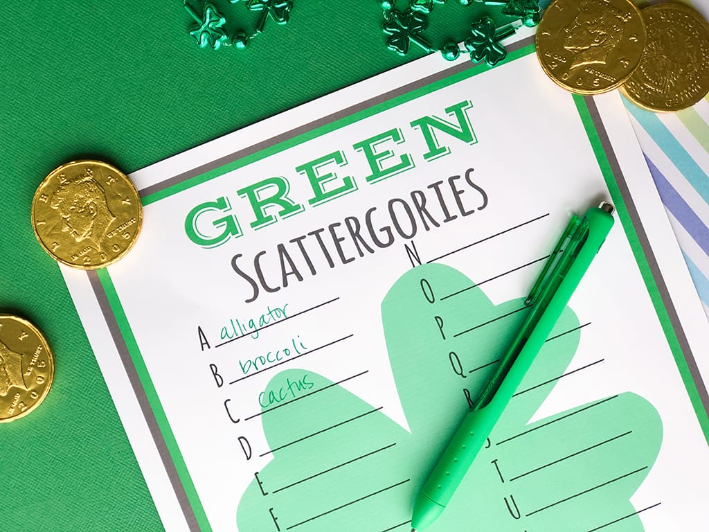 St. Patrick's Day GREEN Scattergories Free Printable on a green background with gold coins and a green pen