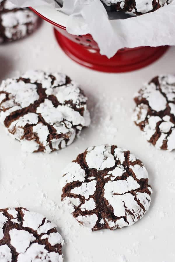 Red bowl full of Decadent Double Chocolate Crinkle Cookies