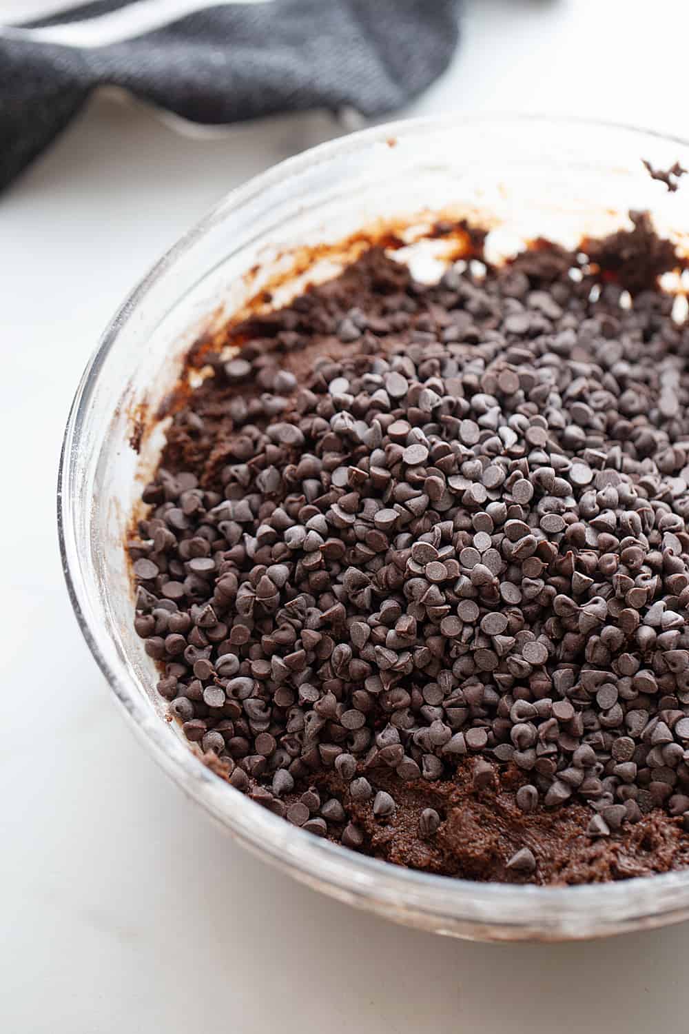 Adding chocolate chips to the Decadent Double Chocolate Crinkle Cookie batter