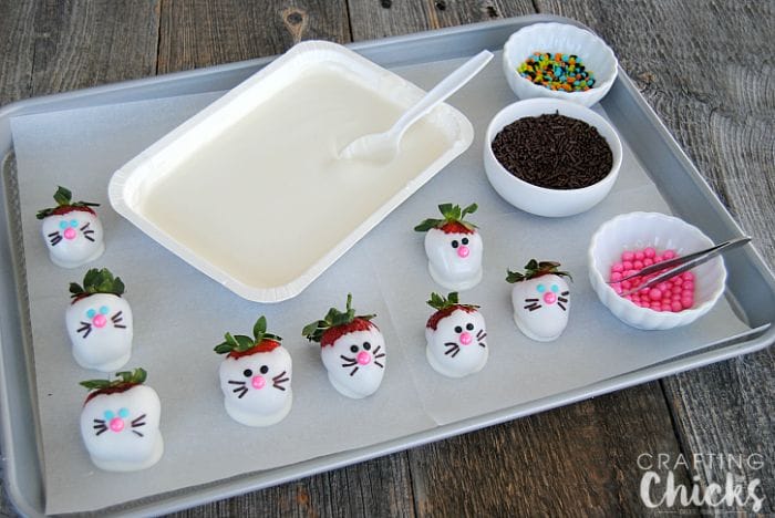 Bunny Face Strawberries! Dip bright ripe strawberries in white chocolate and create sweet faces with sprinkles! This is the cutest Easter dessert!