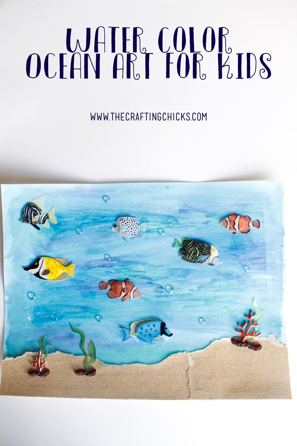 Water color ocean art for kids with 30D elements like fish stickers and sand paper for the sand.
