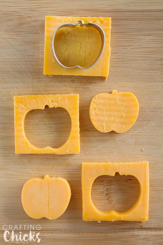 Use a mini apple cookie cutter to make apple shaped cheese for our Apple Themed Lunch! What a cute idea!