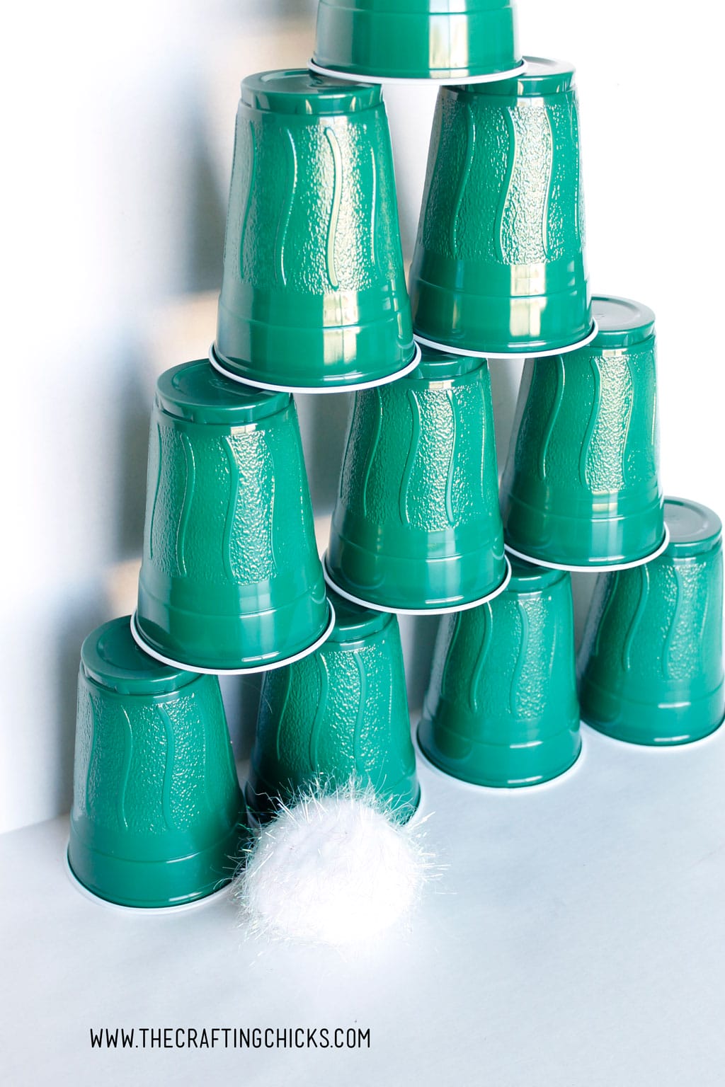 Stacking Cups Christmas Tree Game is a winner! From preschool age to elementary kids, everyone will love knocking down this Christmas Tree with a snowball.