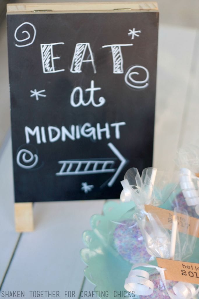 LOVE this Eat at Midnight chalkboard easel - cute touch with the Ball Drop Oreo Pops for New Year's Eve!