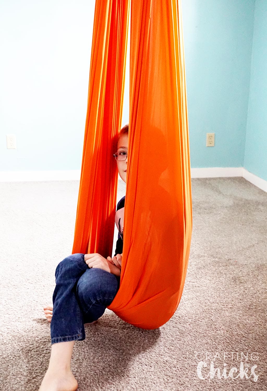 SPD Therapy Swing - What you need to set up a therapy gym at home for sensory processing disorder.