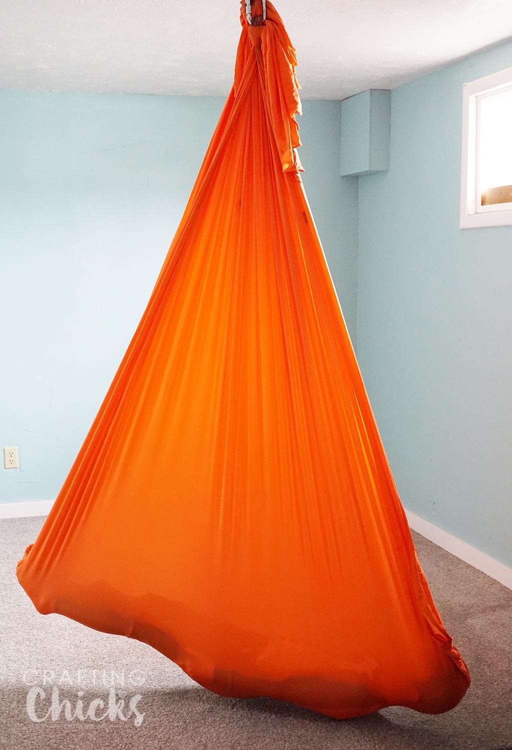 Yoga Hammock for SPD therapy - What you need to set up a therapy gym at home for sensory processing disorder.