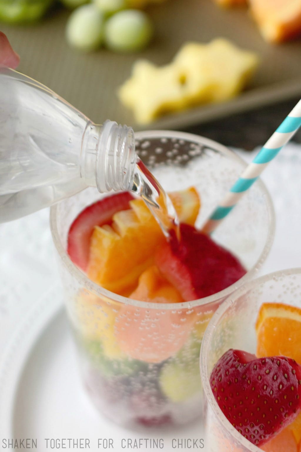 Rainbow Fruit Water with Frozen Fruit - once the frozen fruit is layered in the glass, add regular or sparkling water!