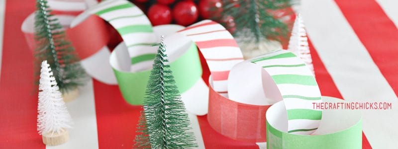 Christmas Breakfast Table with bright red and green decorations and a paper chain.