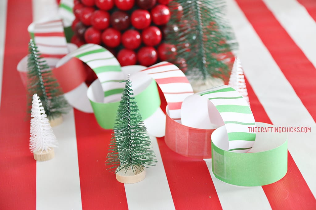 Christmas Breakfast Table with bright red and green decorations and a paper chain.