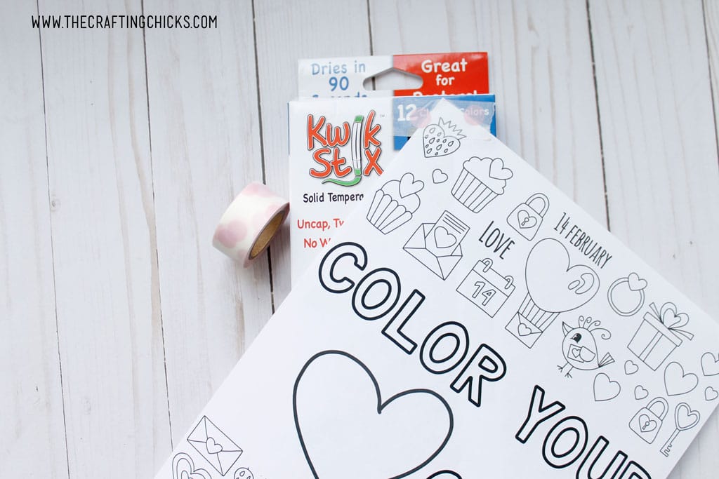 Just print out the Free Color Your Heart Out Valentine Coloring Page, and attach to a Kwik Stix box with some Washi tape. The Washi Tape pulls off really easy so it doesn't ruin the coloring page or the Kwik Stix box.