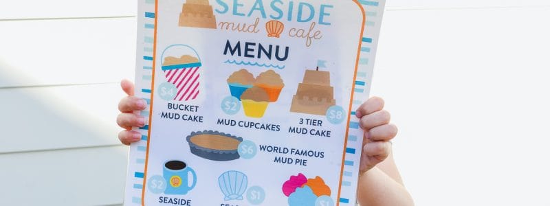 Get outside this summer with this easy outdoor imaginative play idea for kids. Seaside Mud Cafe is the perfect activity that encourages imagination, play, and hands on learning. Includes FREE printables so you can easily set up your own mud kitchen in your own backyard. #kids #activity #outdoor #play #printable #learning #backyard