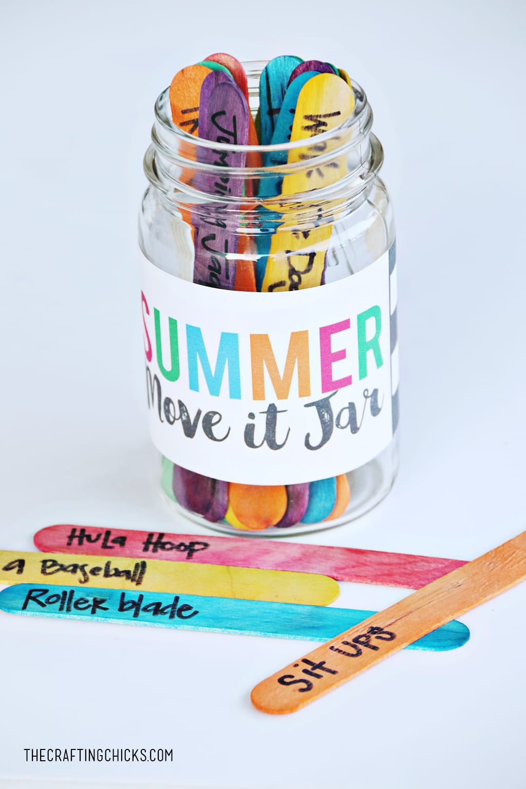Mason Jar with colorful crafts sticks with movement actions written on them for kids to keep moving.
