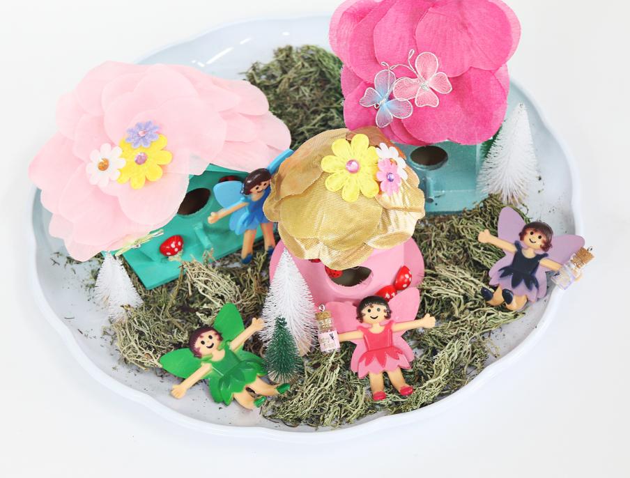fairy garden with a green, pink and purple fairies