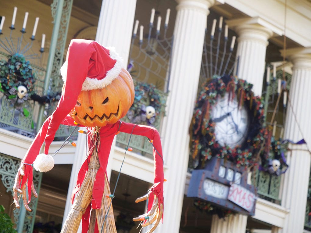 Jack Skellington dressed as Santa in front of the Haunted Mansion at Disneyland Resort