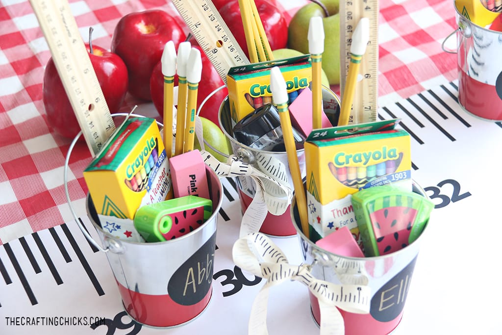 back to school supplies in a cute tin bucket for a gift idea