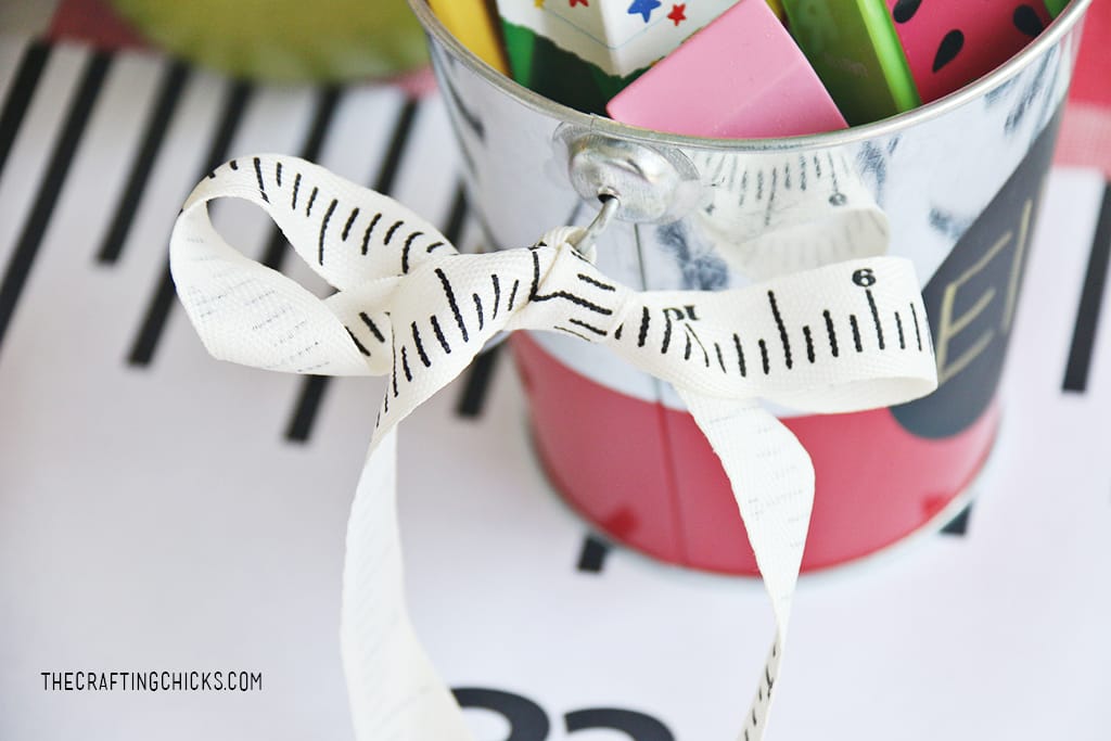Ruler ribbon tied onto a tin bucket for a gift idea