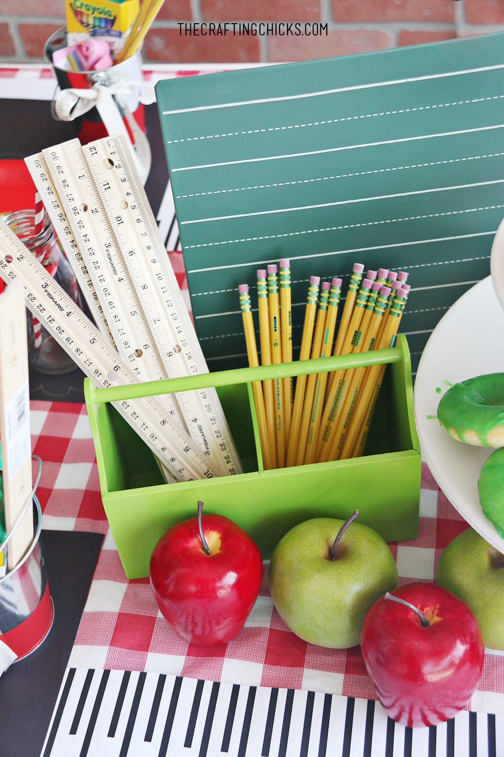 back to school party table, apples and apple donuts