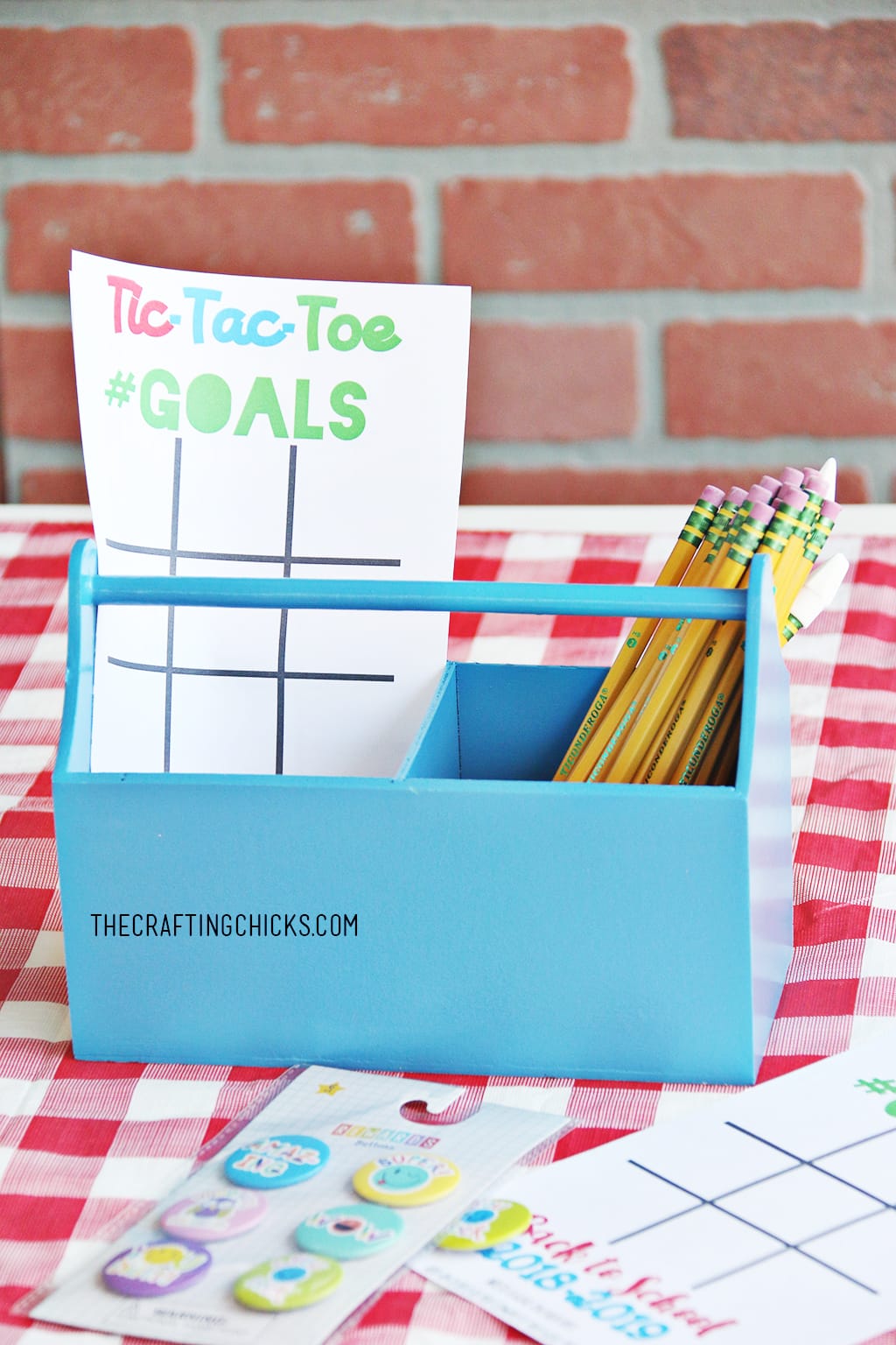 Back to School Goal Setting Tic-Tac-Toe printable in blue caddy with pencils