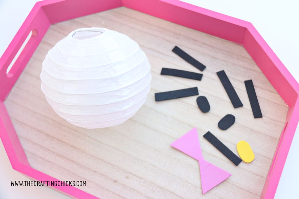 White mini paper lantern with cut out foam shapes to make Hello Kitty DIY Paper Lanterns