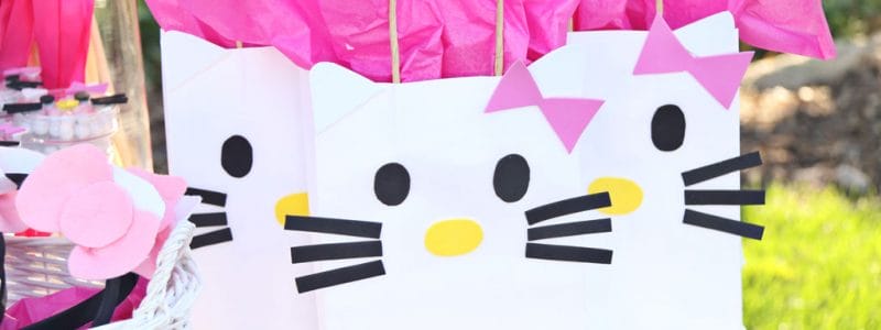 Hello Kitty DIY Gift Bags on party table for Hello Kitty Party
