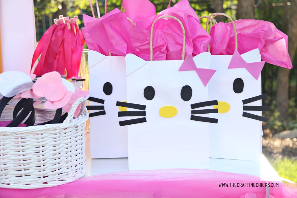 Hello Kitty DIY Gift Bags on table at a hello kitty party