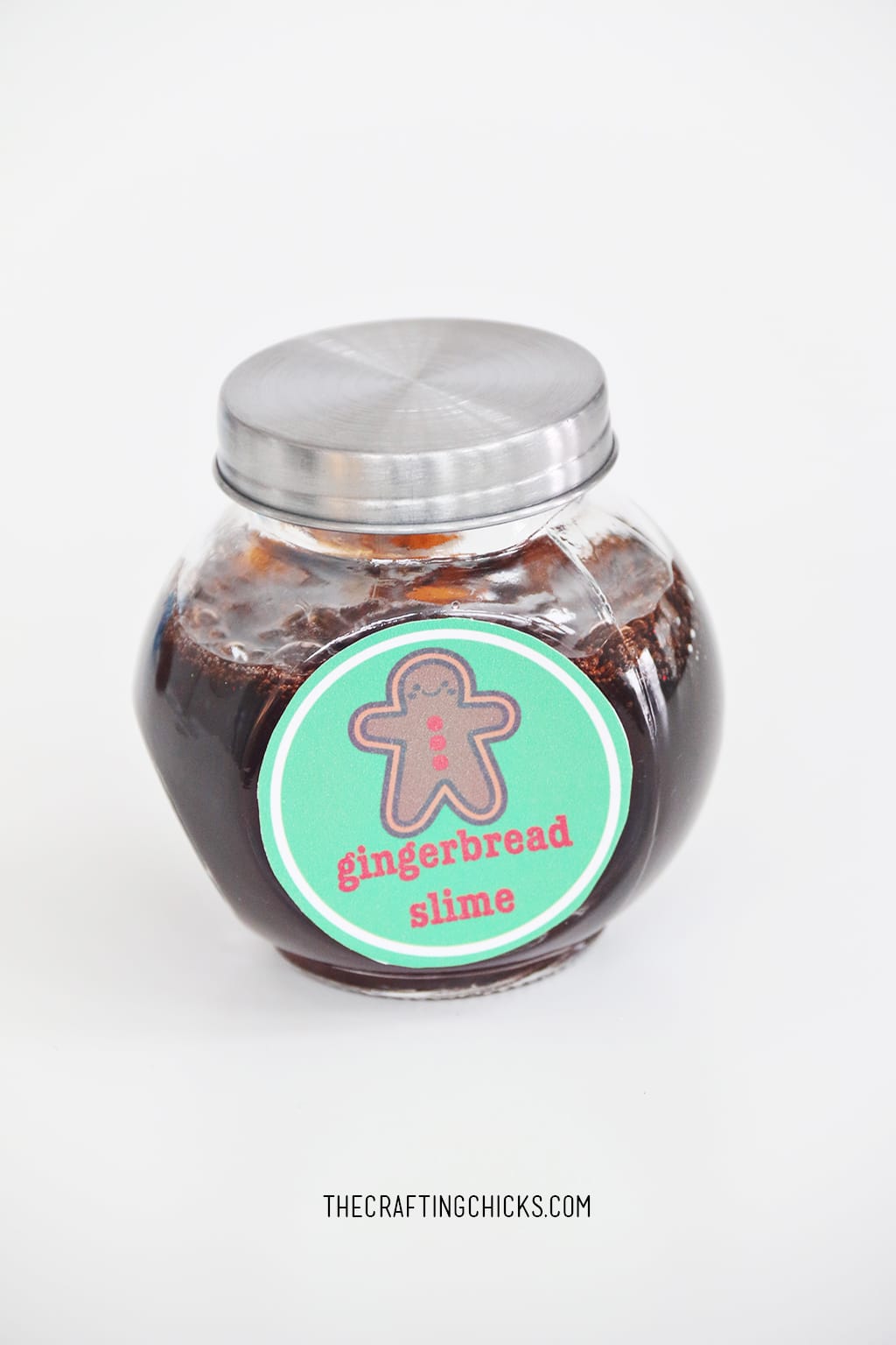 Brown Slime in a glass jar with lid and Gingerbread Slime tag on jar.
