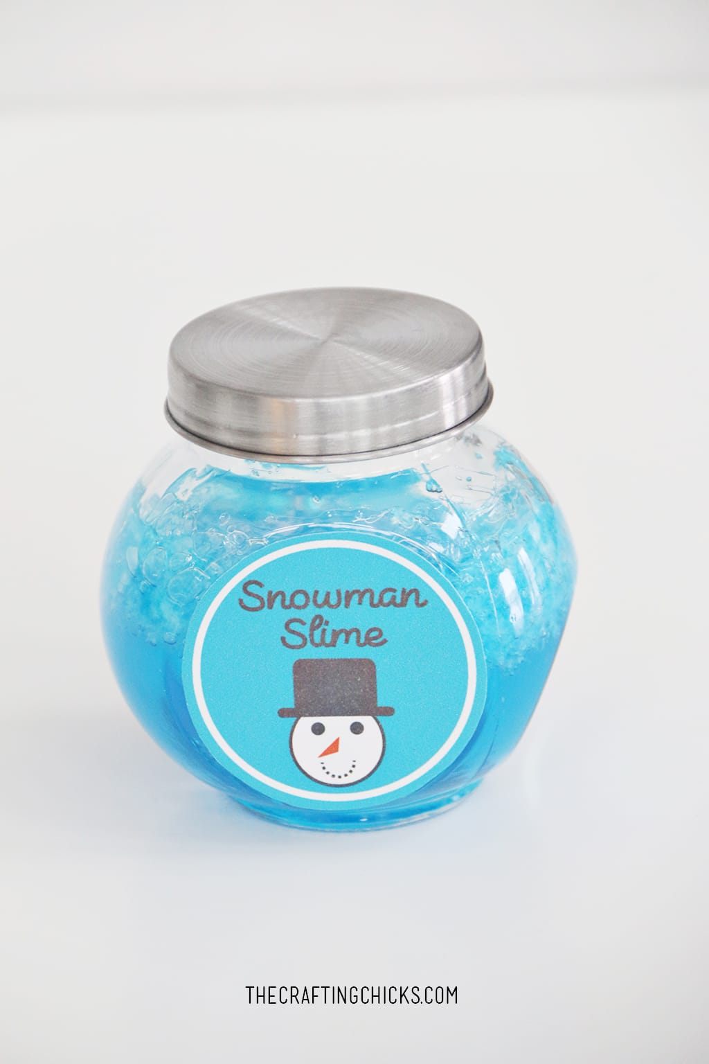 Blue Slime in a jar with a lid and take on jar that says Snowman Slime