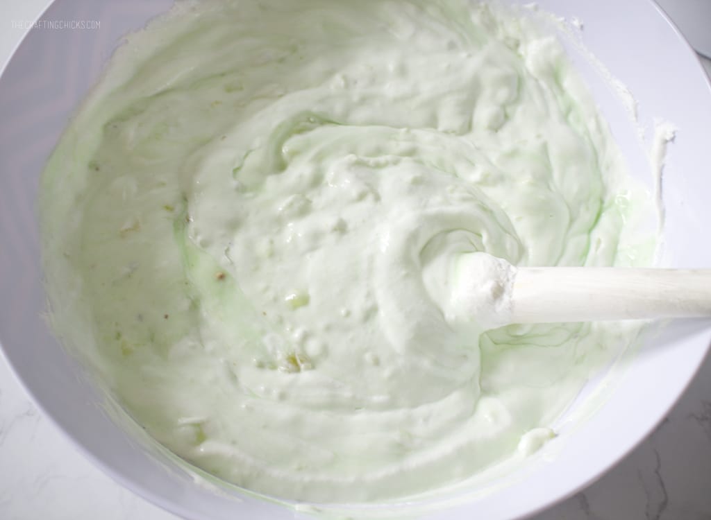 Pistachio pudding mixed together with crushed pineapple and whipped topping for Watergate Salad Recipe