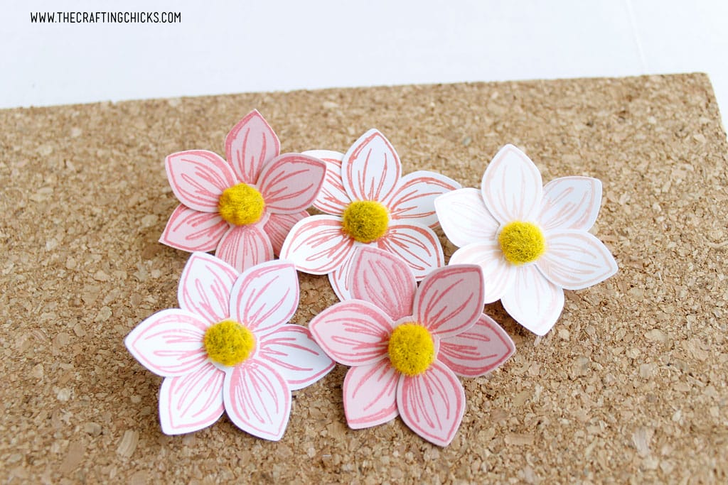 Stamped flowers turned into push pins