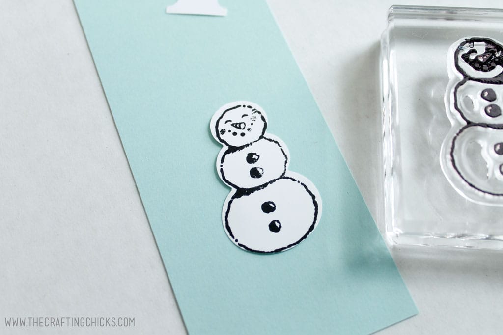 Snowman stamped onto snowman shape