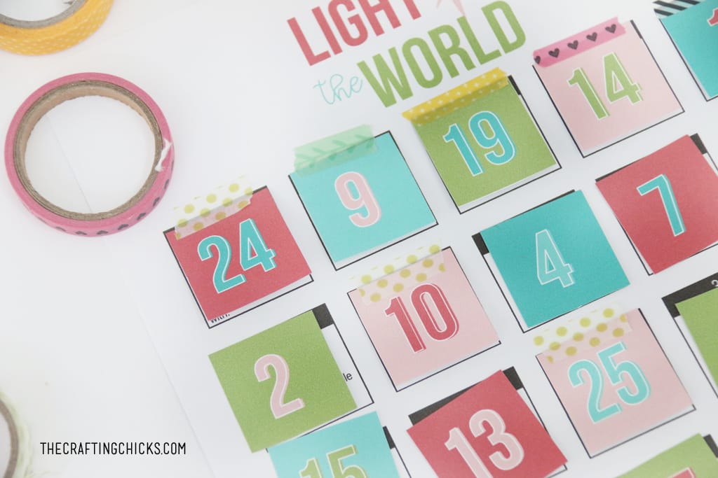Attach the number squares for the Light the World Advent using washi tape or glue.