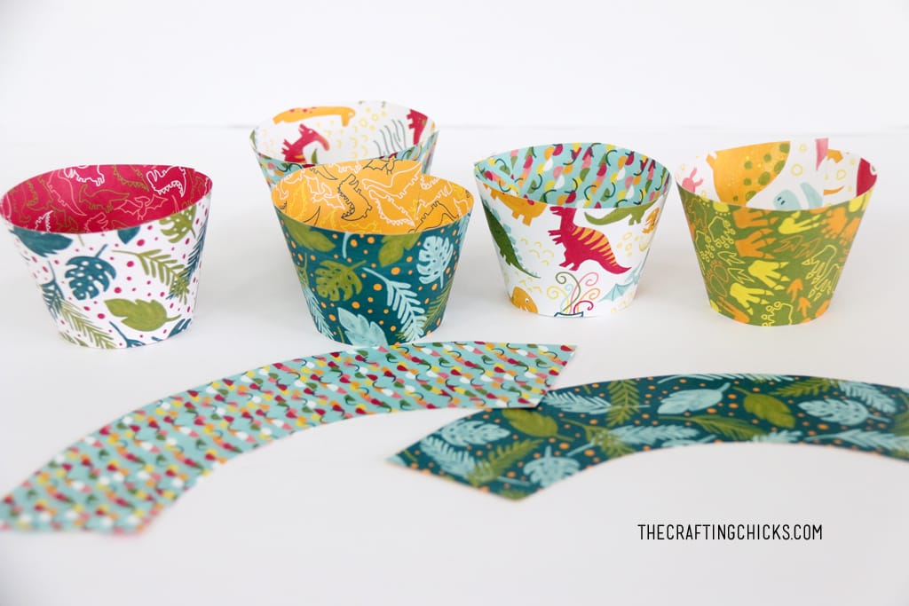 DIY Cupcake wrappers made with dinosaur scrapbook paper.