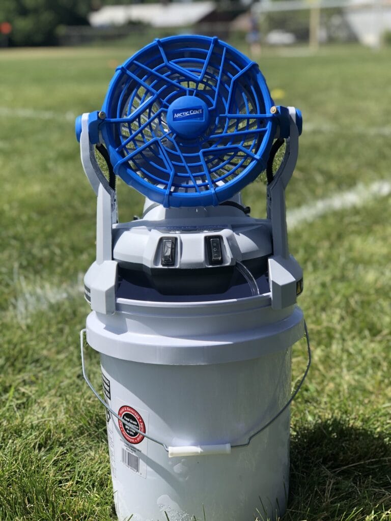 Blue fan on top of a 5 gallon bucket for sports games