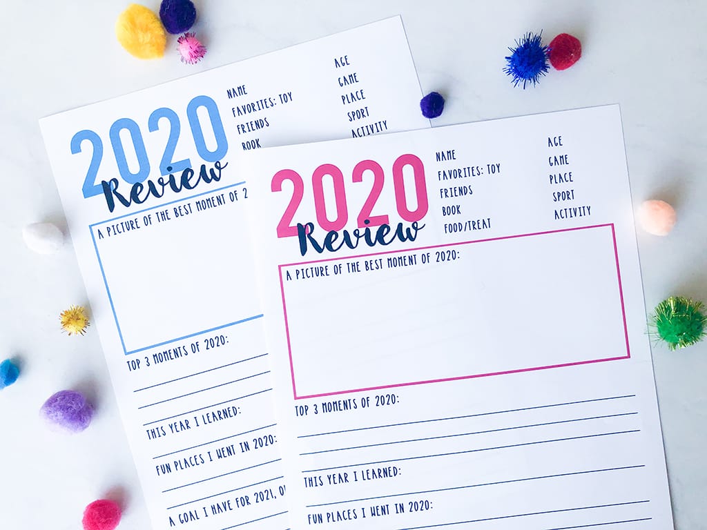 Year in review printables for kids and family on white background and blue and pink typing