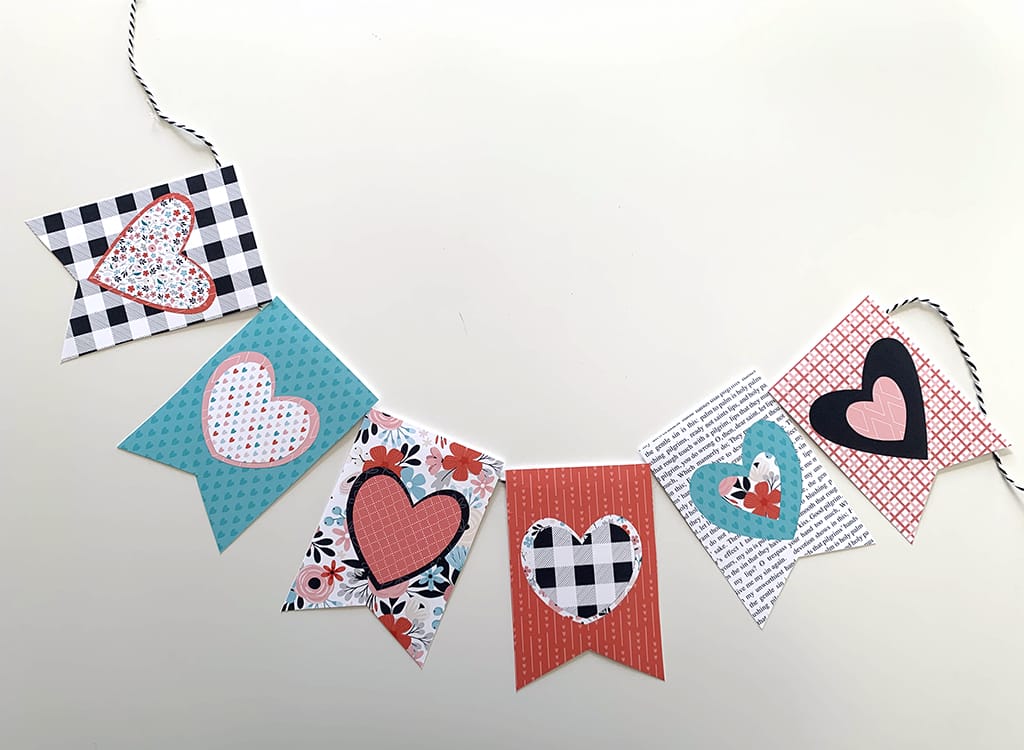 Valentine Banner in black, white, read, pink, and teal with hearts on a white background
