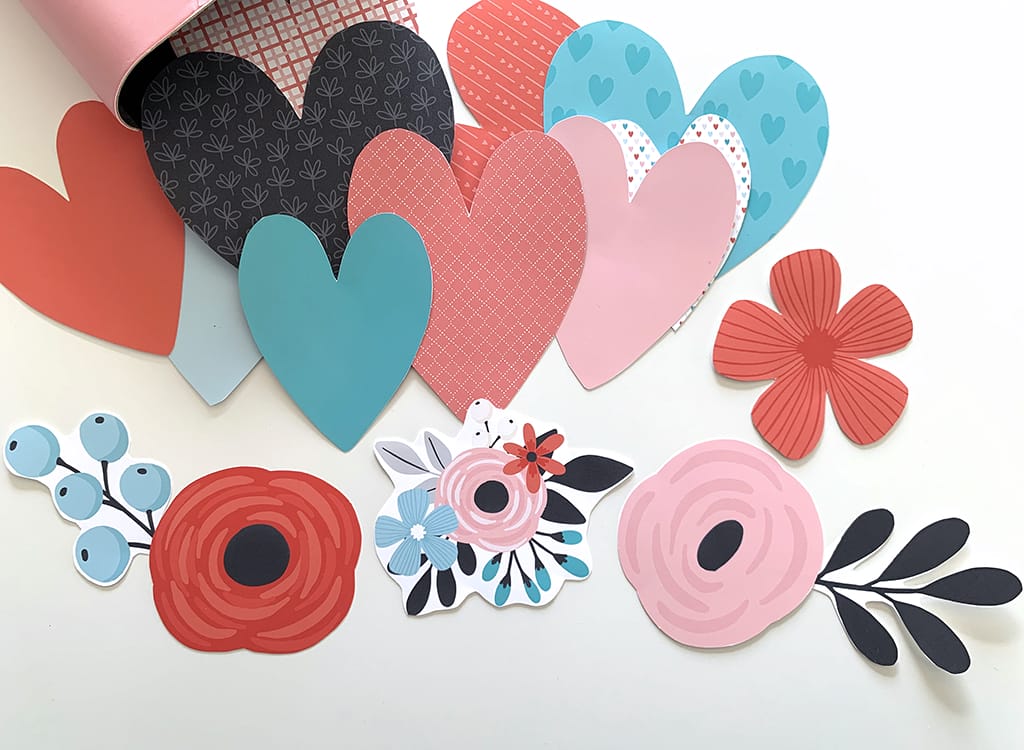Valentine printable hearts and flowers in pink, red, white, black and teal on a white background 