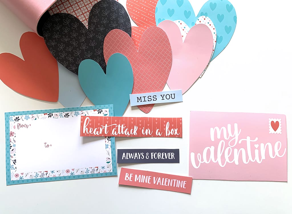 Valentine word art in black, white, read, pink, and teal with hearts on a white background