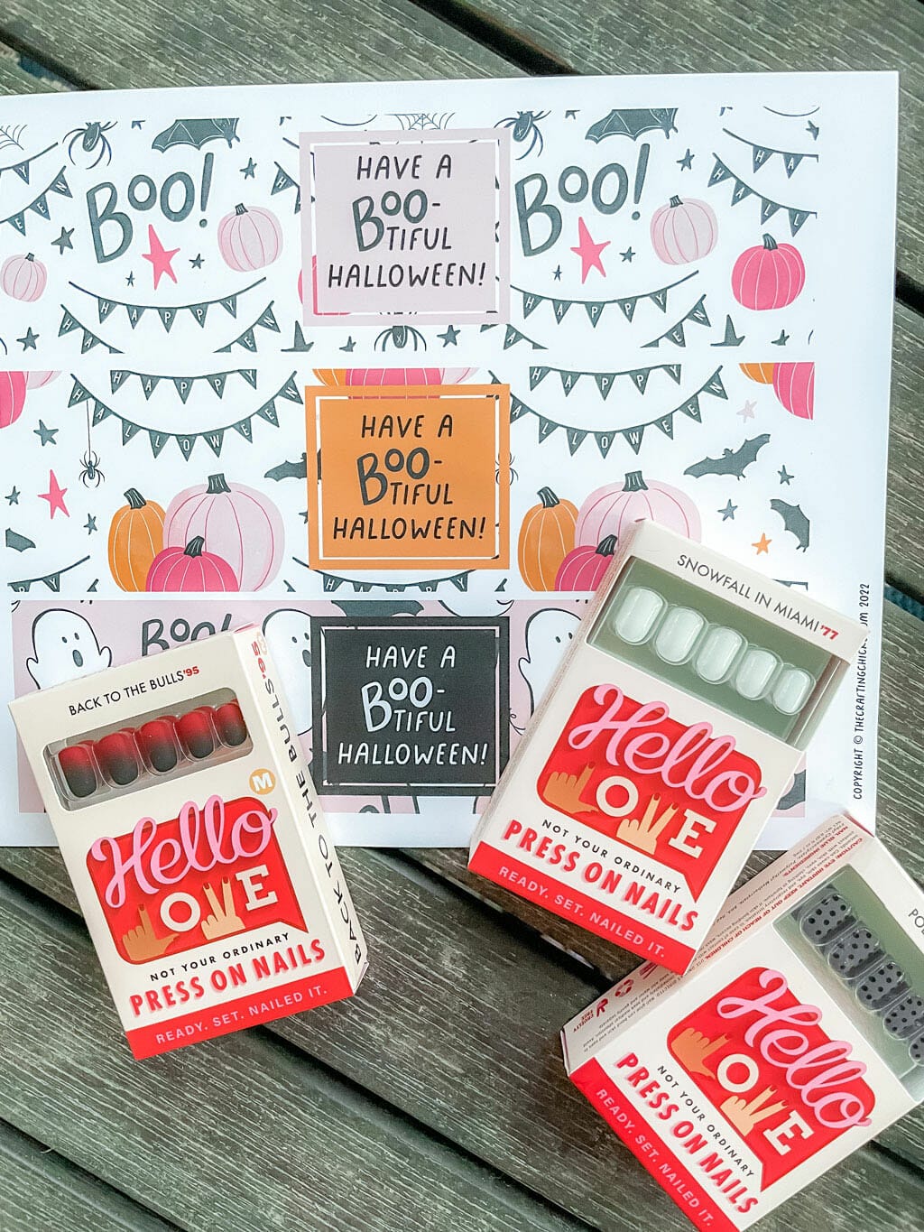 Halloween Printable gift tags in background with 3 boxes of Hello Love Inc. Nails